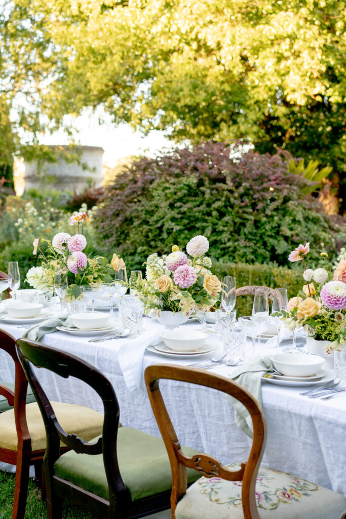 table rrangement with chairs, table and flowers