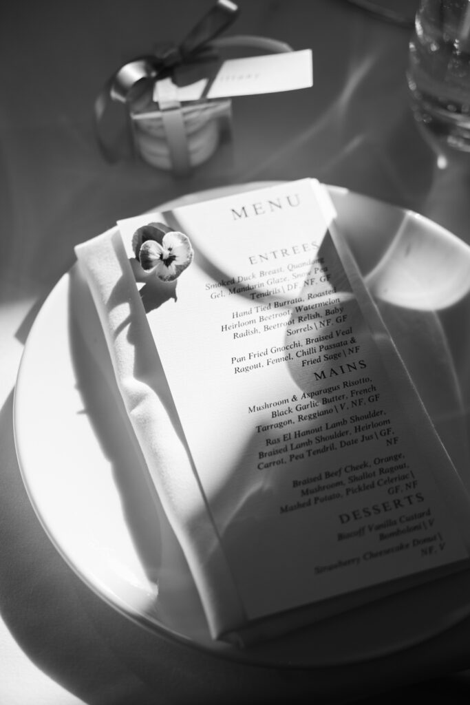 black and white photo of flower and table menu