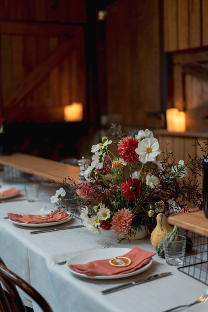 Table setting with vase of fresh flowers