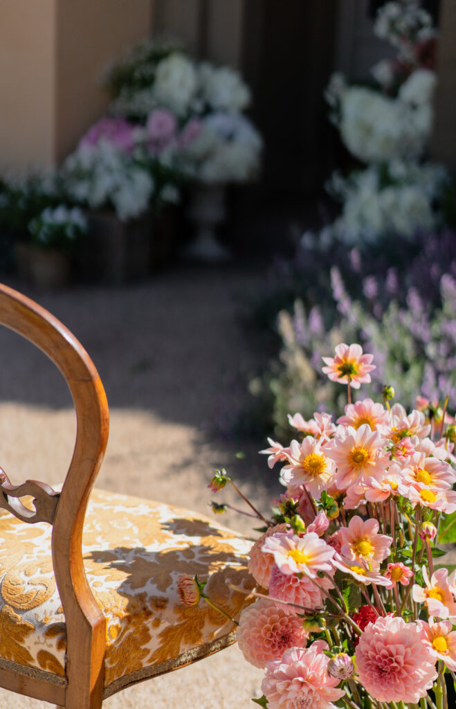 Flowers beside antique chairs