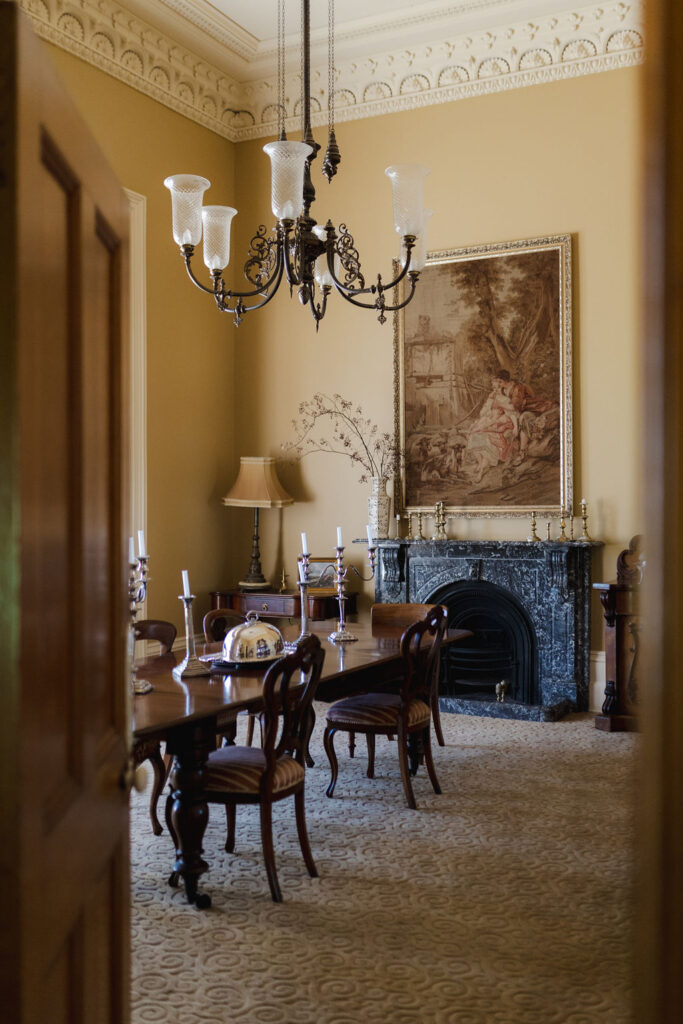 Dining room table with a chandelier above