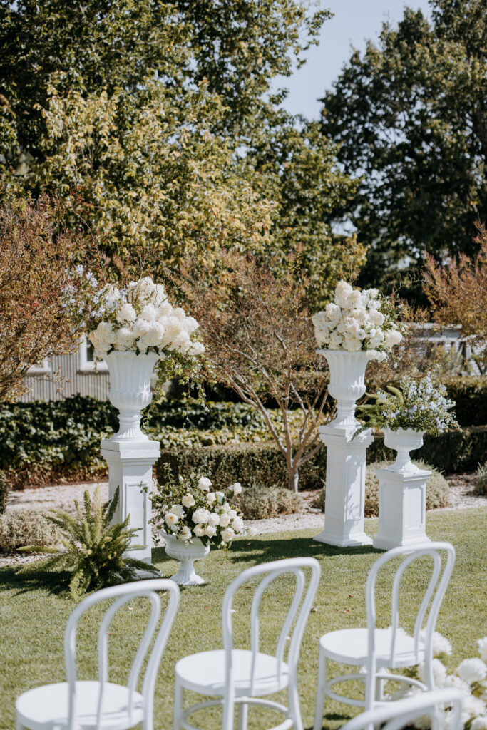 Flowers in large vase on plinths