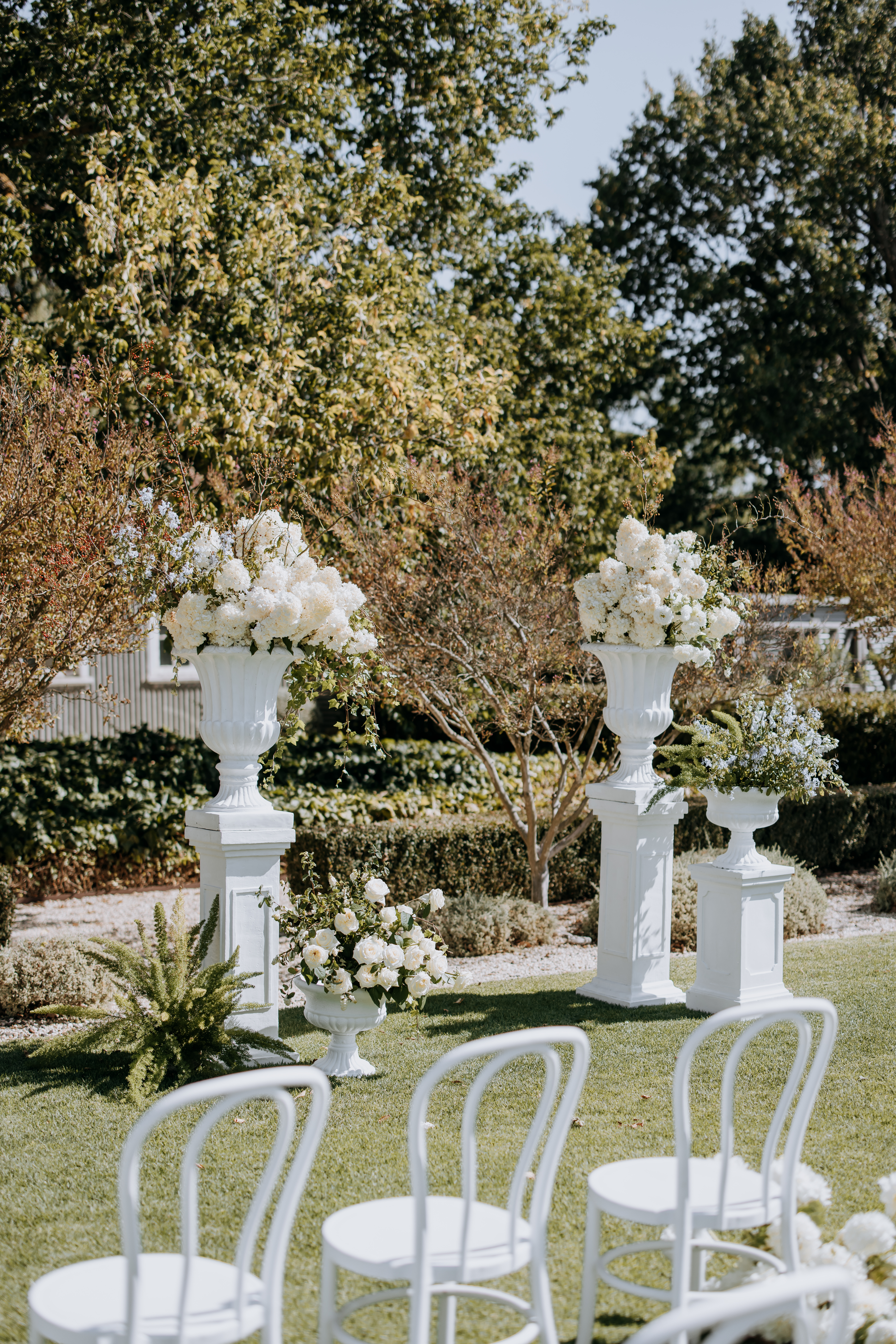 Flowers in large vase on plinths